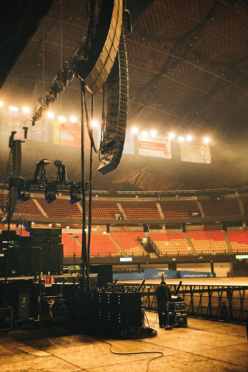 PA system rigged in a hall ahead of a show